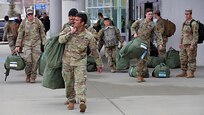 Alaska National Guard Soldiers assigned to 1st Battallion, 297th Infantry Regiment depart Ted Stevens International Airport after returning from a 9 month deployment in Kosovo, Apr 4, 2020. Prior to returning to their home state, the Soldiers were quarantined for 14 days in El Paso Texas, amid the COVID-19 pandemic. (U.S. Army National Guard photo by Sgt. Seth LaCount/Released)
