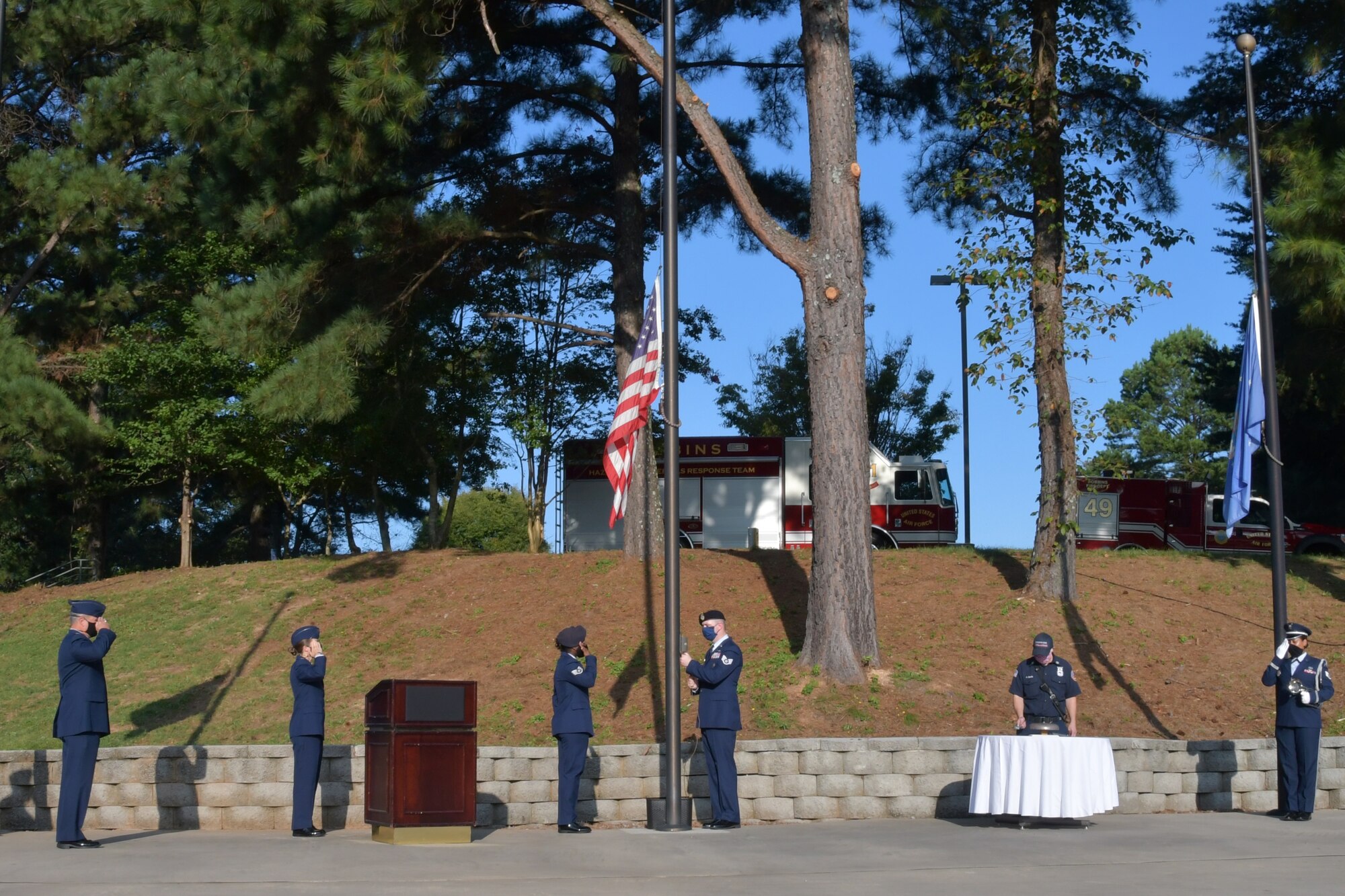 Airmen with the 94th Airlift Wing salute during a 9/11 Remembrance Ceremony at the POW/MIA Memorial at Dobbins Air Reserve Base, Ga. The ceremony included a moment of silence, command commentaries and an honor guard presentation. (U.S. Air Force photo by Senior Airman Shelby Thurman)