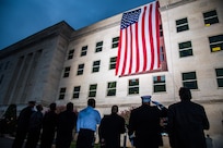 A Pentagon crew unfurls an American flag at dawn at the Pentagon, on the 18th anniversary of the 9/11 attacks, Washington, D.C., Sept. 11, 2019. (DoD photo by U.S. Army Staff Sgt. Nicole Mejia)