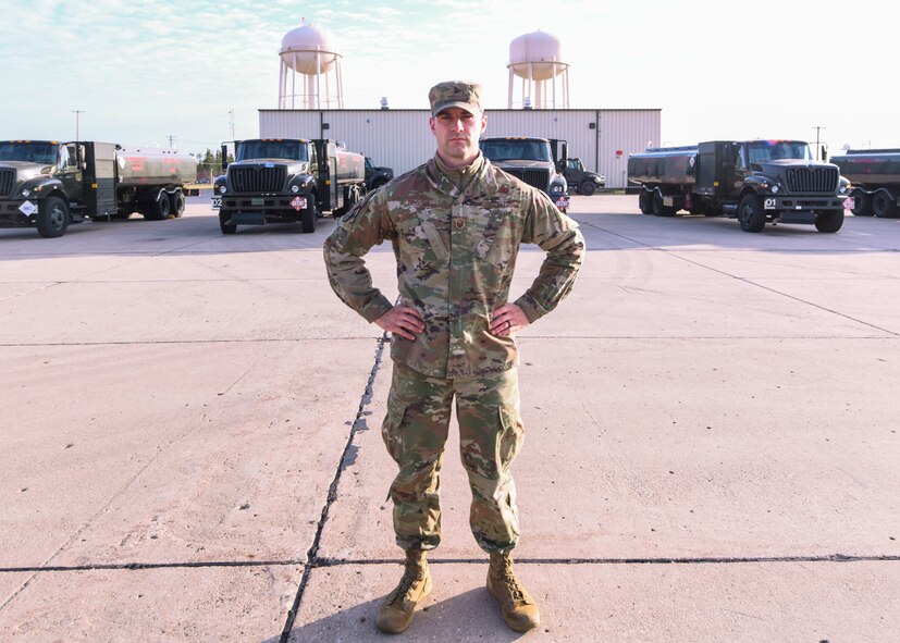 Master Sgt. John Broome, 5th Logistics Readiness Squadron Fuels Operations section chief, stands in front of refueling trucks Sep. 9, 2020, at Minot Air Force Base, North Dakota. Broome implemented a new system to track refueling trucks.The new system will be a virtual tracker, similar to what post offices use to scan and track packages. The system will have less chance of human error, thus making the tracking more accurate than previous methods.
 (U.S. Air Force photo by Airman First Class Jan K. Valle)
