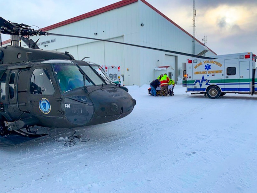 An Alaska Army National Guard UH-60 Black Hawk helicopter aircrew performed a search and rescue mission for three Iditarod mushers about 25 miles east of Nome, March 20, 2020. The mushers and their dogs went through Bering Sea flood waters on the race trail and were wet and freezing. The aircrew transported two firefighter emergency medical technicians and Iditarod dog handlers to assist. The mushers were flown to Nome and transported to a local hospital. A local search and rescue team helped race dog handlers care for the sled team and returned them to Nome. (Courtesy photo)