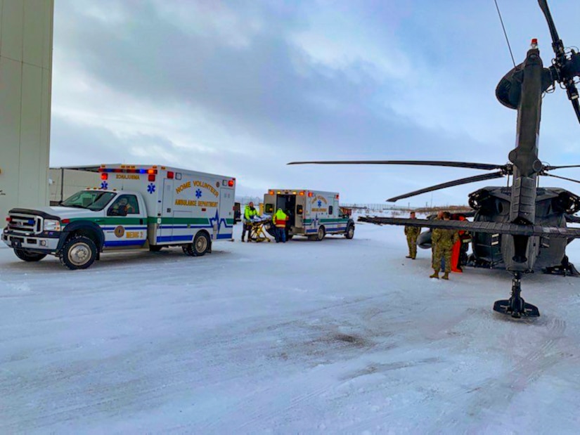 An Alaska Army National Guard UH-60 Black Hawk helicopter aircrew performed a search and rescue mission for three Iditarod mushers about 25 miles east of Nome, March 20, 2020. The mushers and their dogs went through Bering Sea flood waters on the race trail and were wet and freezing. The aircrew transported two firefighter emergency medical technicians and Iditarod dog handlers to assist. The mushers were flown to Nome and transported to a local hospital. A local search and rescue team helped race dog handlers care for the sled team and returned them to Nome. (Courtesy photo)