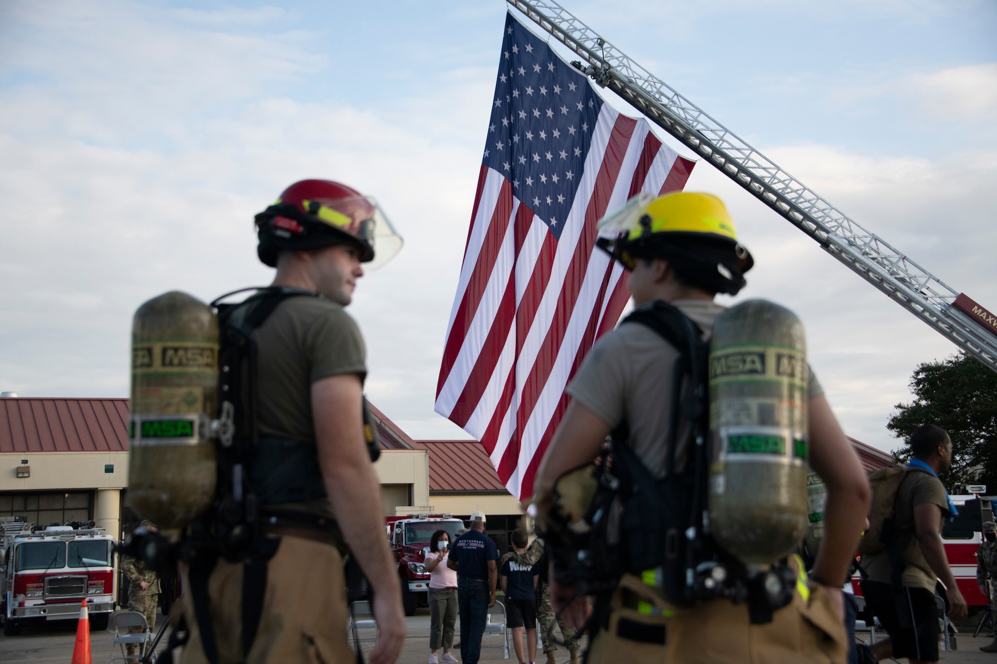 Firefighters from the 42nd Air Base Wing attend a 9/11 remembrance ceremony, Sept. 11, 2020, on Maxwell Air Force Base, Alabama. Prior to the ceremony, members from the Maxwell-Gunter community participated in a 2.72 mile ruck march. (U.S. Air Force photo by Airman 1st Class Jackson Manske)