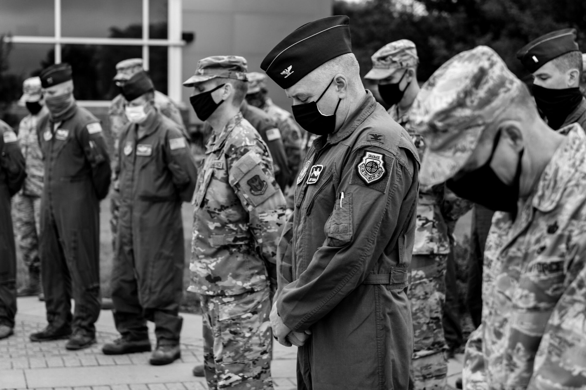 910th Airlift Wing members bow their heads, Sept. 11, 2020, during the invocation at Youngstown Air Reserve Station’s 9/11 remembrance ceremony. The installation has held a ceremony every year to honor those who lost their lives on Sept. 11, 2001.