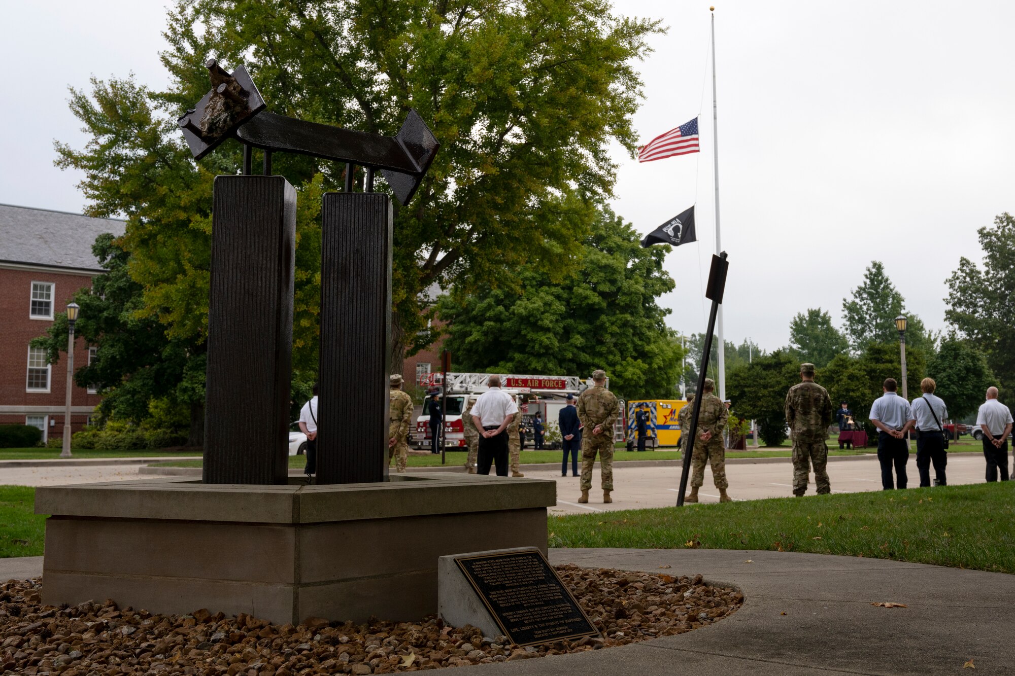 Service members raise U.S. Flag