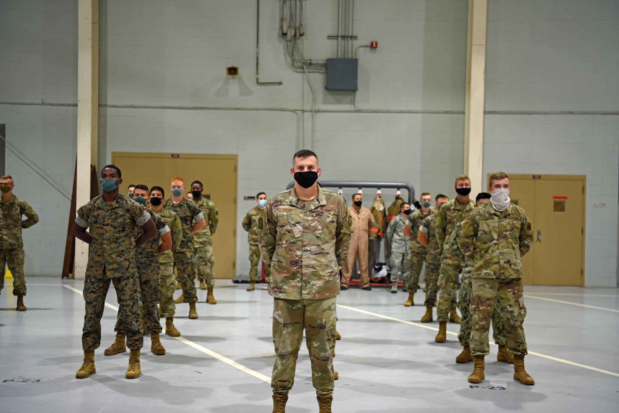 Students of the 312th Training Squadron stand at parade rest for a moment of silence in honor of those who perished during 9/11 at the Louis F. Garland Department of Defense Fire Academy on Goodfellow Air Force Base, Texas, September 11, 2020. The 312th TRS is responsible for training all DoD firefighters and dedicates events to the firefighters who died in the September 11 attacks. (U.S. Air Force photo by Airman 1st Class Ethan Sherwood)