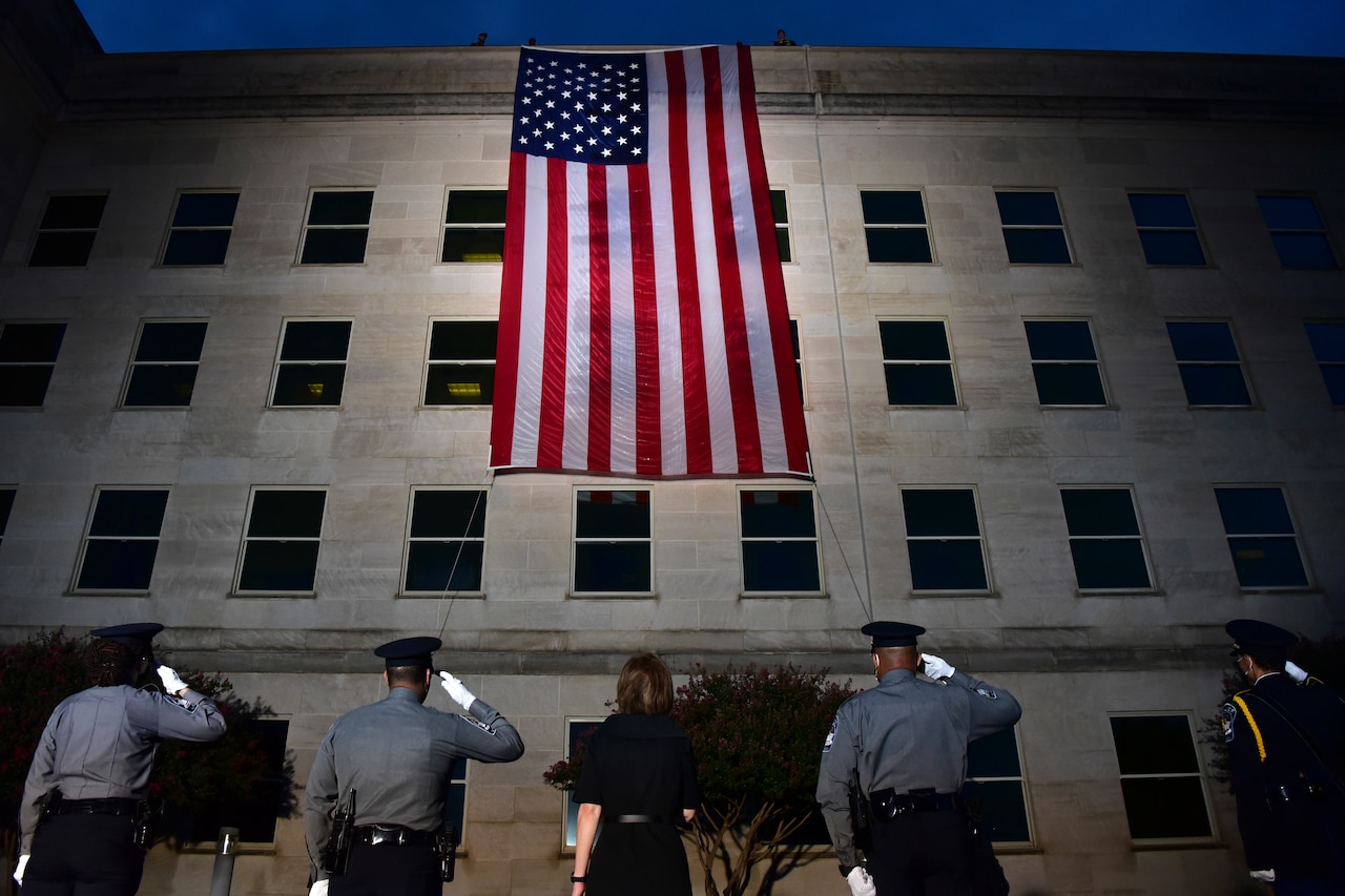 People salute flag.