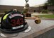 photo of a firefighters helmet with the words, never forget, displayed on during a 9/11 remembrance ceremony