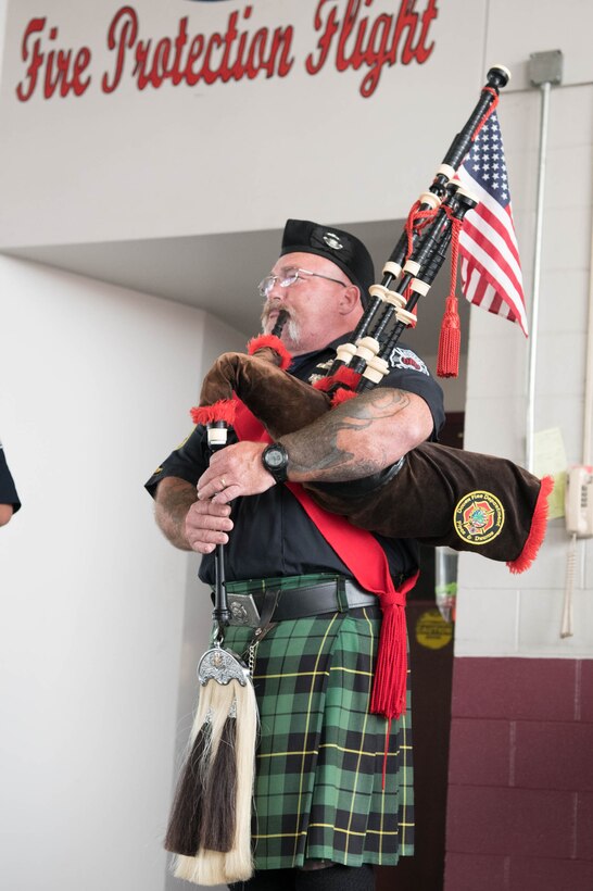 Joey Moran, Dover Police and Fire Pipes and Drums pipes major, plays “Amazing Grace” at the conclusion of the 19th Anniversary 9/11 memorial event Sept. 11, 2020, at Dover Air Force Base, Delaware. Members of the group pay their respects to those who perished on 9/11 by participating in the memorial event each year. (U.S. Air Force photo by Mauricio Campino)