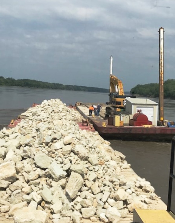 U.S. Army Corps of Engineers, Kansas City District's floating plant places rock on a Missouri River training structure near river mile 105 (Gasconade Bend).