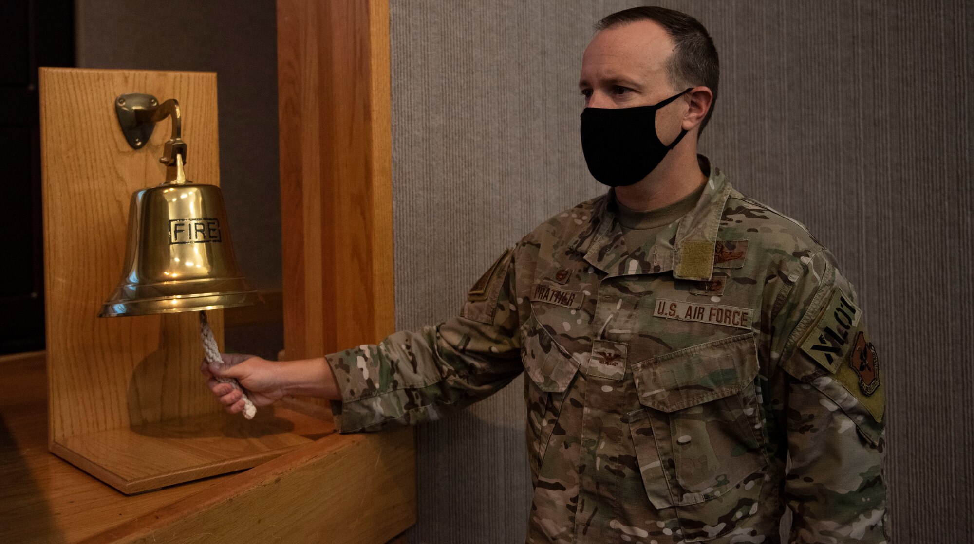 Col. Craig Prather, 47th Flying Training Wing commander, sounds the bell at the close of the 9/11 Remembrance Ceremony on Sept. 11, 2020 at Laughlin Air Force Base, Texas. The bell is rung for all victims, heroes, survivors, and families of all those who lost their loved ones during the terrorist attacks.