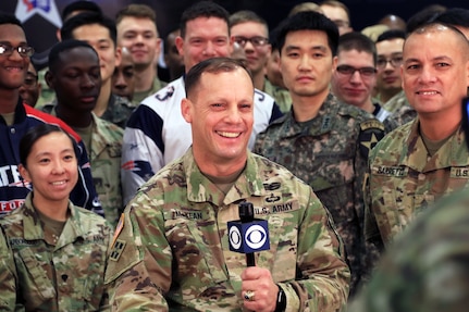 Soldiers gathered for a television camera.