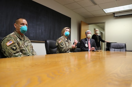 People in a meeting at a table.