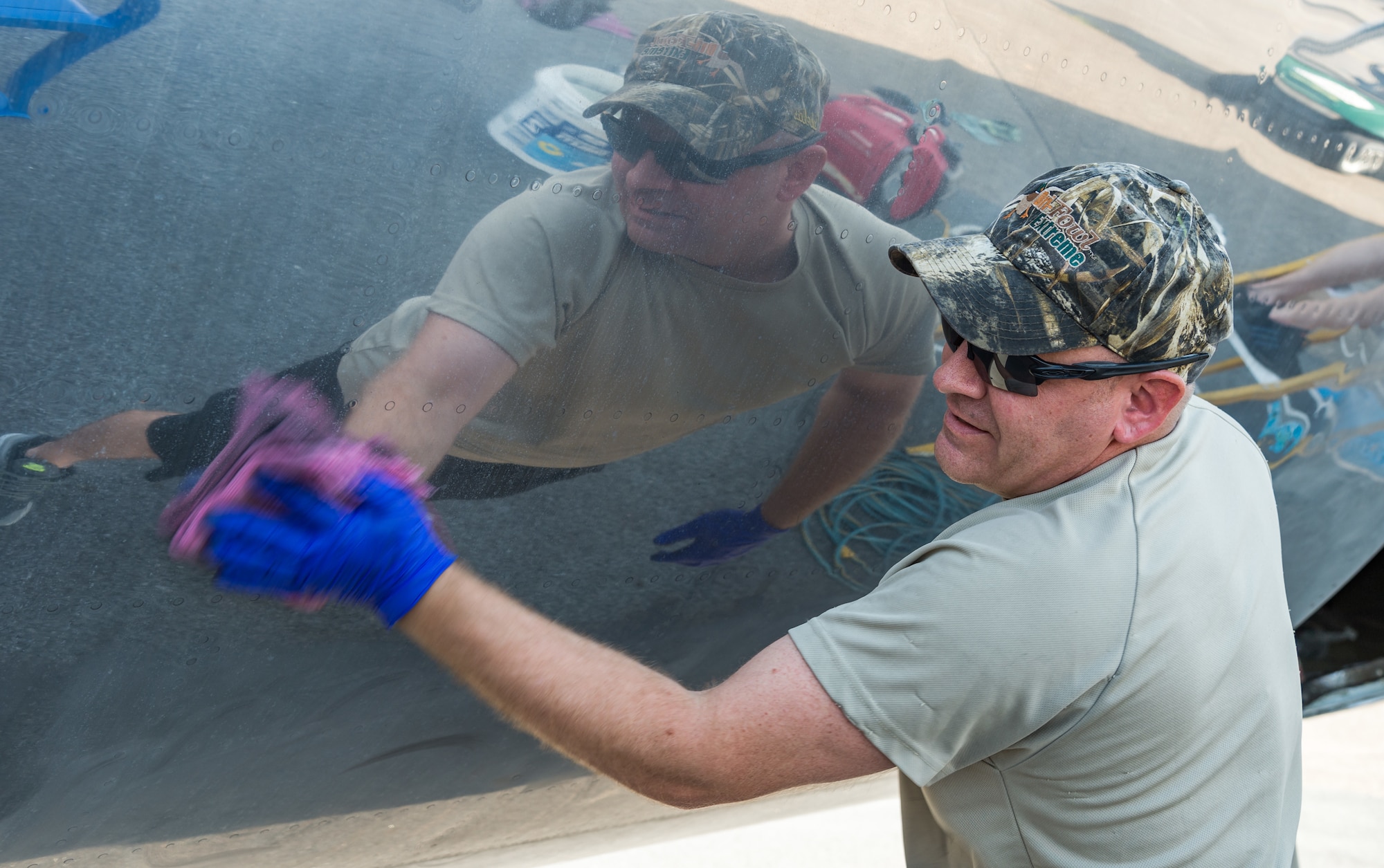 Tech. Sgt. Don Caber, 436th Maintenance Squadron aircraft hydraulic section chief and volunteer project lead, removes cleaning compound from the fuselage of a McDonnell Douglas VC-9C Aug. 25, 2020, at Air Mobility Command Museum on Dover Air Force Base, Delaware. Caber, along with other members of the hydraulic section, volunteered to strip, clean and polish the shiny aluminum skin of the aircraft. (U.S. Air Force photo by Roland Balik)