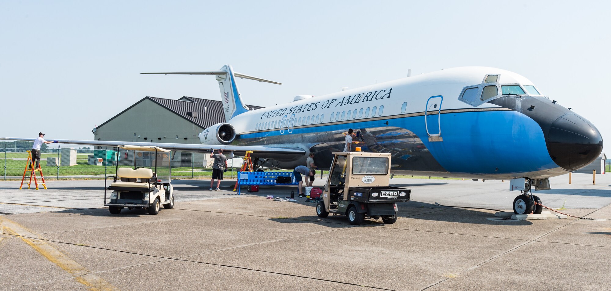 Volunteers from the 436th Maintenance Squadron aircraft hydraulic section, apply and remove cleaning compound on the fuselage and wing of a McDonnell Douglas VC-9C Aug. 25, 2020, at Air Mobility Command Museum on Dover Air Force Base, Delaware. During a two-day period, the volunteers, stripped, cleaned and polished the shiny aluminum skin of the aircraft when the museum was closed to the public. (U.S. Air Force photo by Roland Balik)