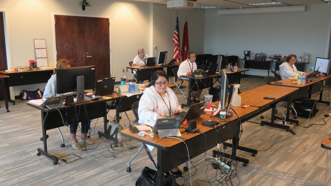 Staff from the U.S. Army Corps of Engineers (USACE) take calls from people in Louisiana seeking information on the temporary roofing program at a call center in Jacksonville Florida.  Operation Blue Roof is a program managed by USACE on behalf of FEMA that installs fiber-reinforced sheeting to cover damaged roofs on the homes of Hurricane Laura survivors until arrangements can be made for permanent repairs.