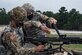 Photo of soldier clearing an M240.