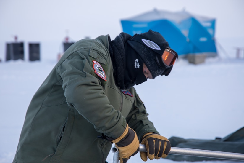 Captain Jason Grupp assists in building a polar chief arctic weather shelter as part of the ski way construction team during Air National Guard exercise Arctic Eagle

(U.S. Air National Guard photo by Technical Sergeant Jamie Spaulding/released)
