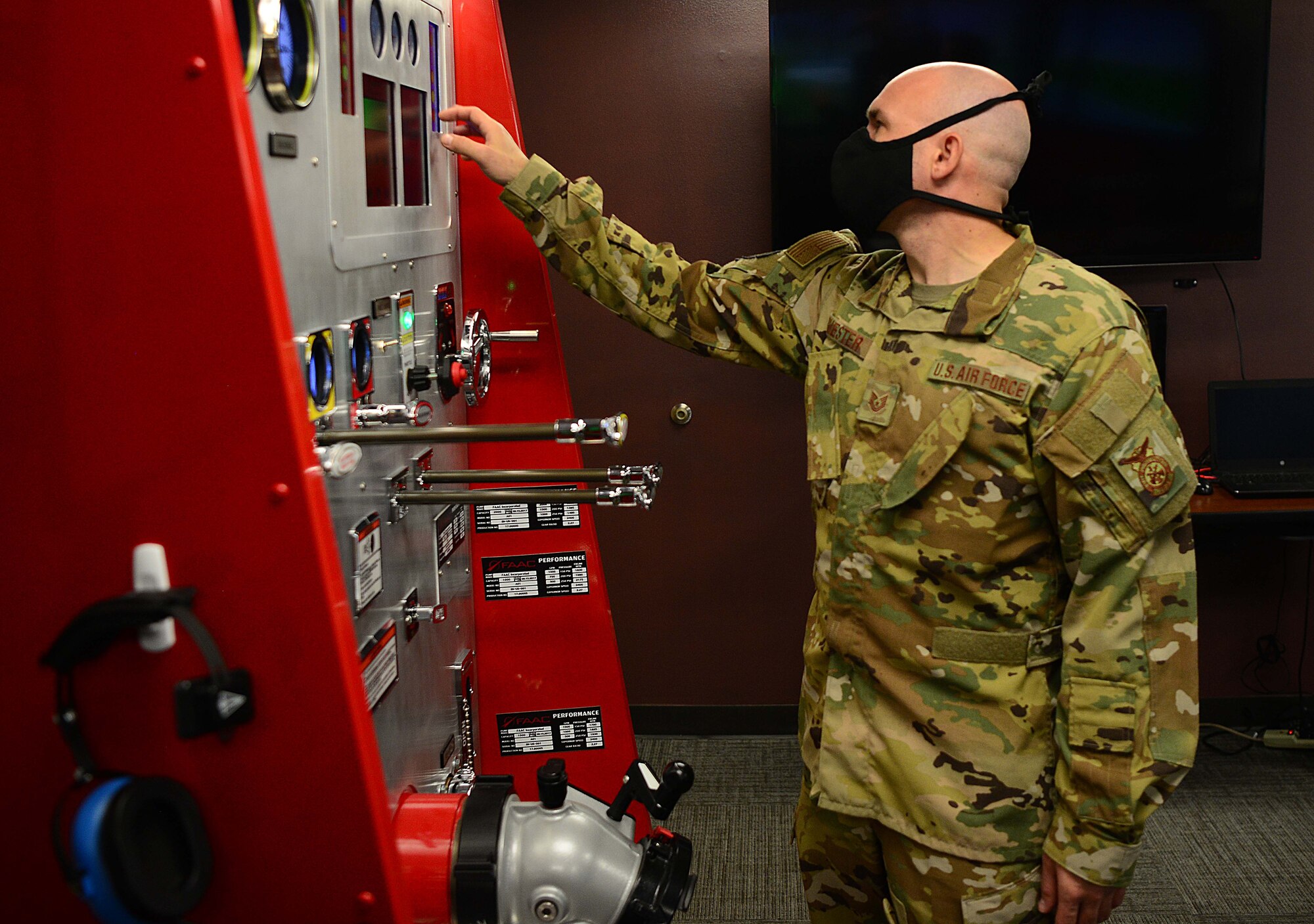 U.S. Air Force Tech. Sgt. Scott Ruester, the 354th Fire Emergency Services assistant chief of operations, demonstrates a fire engine simulator at the main fire station on Eielson Air Force Base, Alaska, Sept. 11, 2020. The mission of the Eielson Fire Department is to provide fire emergency services for the preservation of life, property and the mission of Eielson AFB. (U.S. Air Force photo by Staff Sgt. Sean Martin)