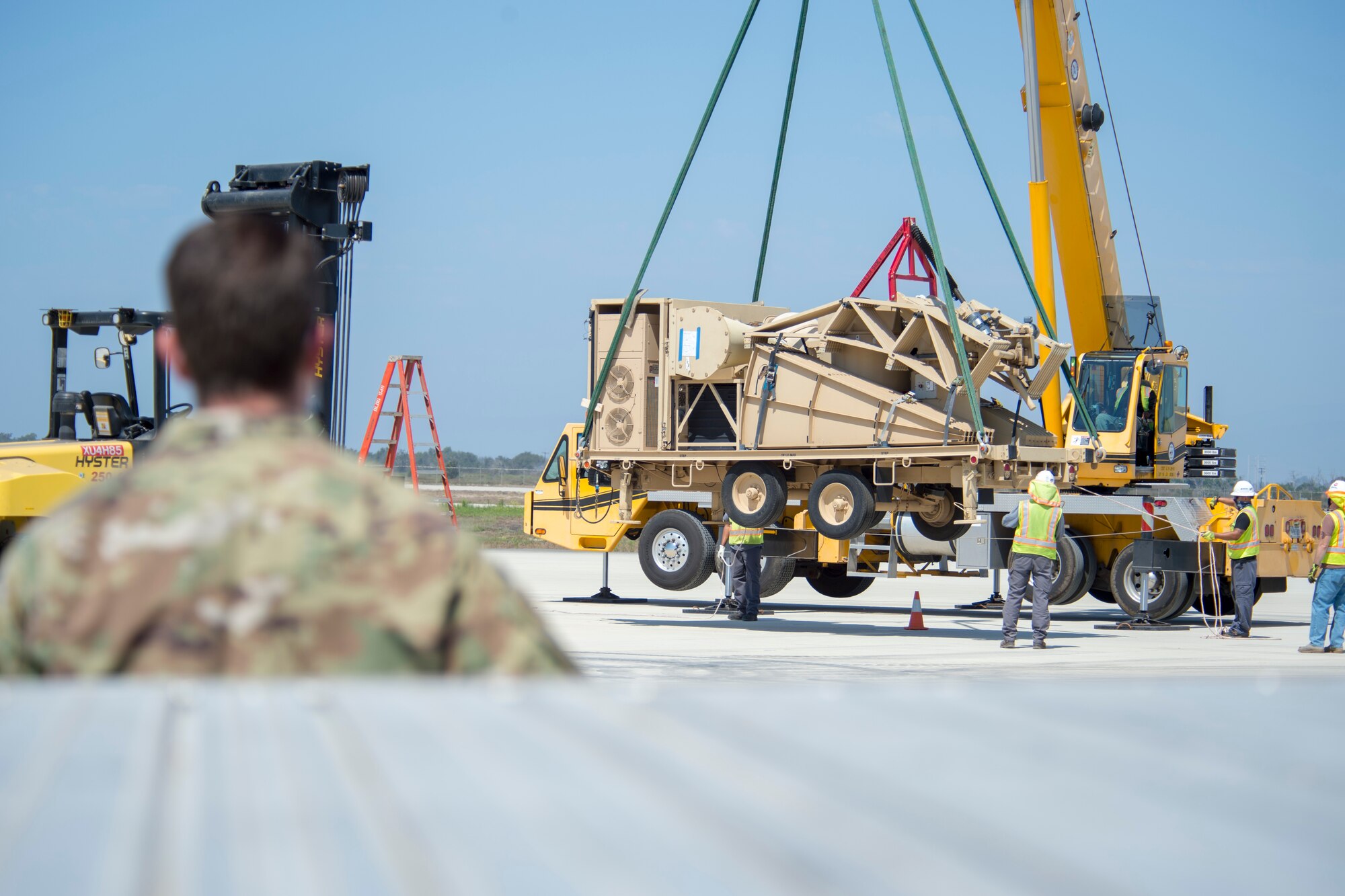 Master Sgt. Aaron Fernandez, 163rd Maintenance Squadron ground control station communications flight chief from March Air Reserve Base, California, watches a Satellite Earth Terminal Subsystem delivery during Exercise Agile Reaper,  Sept. 5, 2020, at Naval Air Station Point Mugu, California. This routine training exercise focuses on the improvement of Total Force relationships and operational capabilities while demonstrating the agile, penetrating and persistent multi-role maritime combat capabilities of the aircraft. (U.S. Air Force photo by Senior Airman Collette Brooks)