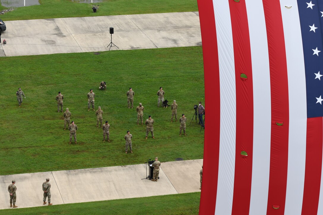A formation of first responders from Joint Base Andrews stand at parade rest during the 9/11 remembrance ceremony at Heritage Park, JBA, Md., Sept. 11, 2020.
