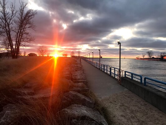 The lights have turned on as the sun sets over the iconic boardwalk and pier in Grand Haven, Michigan. Though bare during the cold months, summertime brings people from around the country appreciating the Great Lakes via this USACE-built structure.