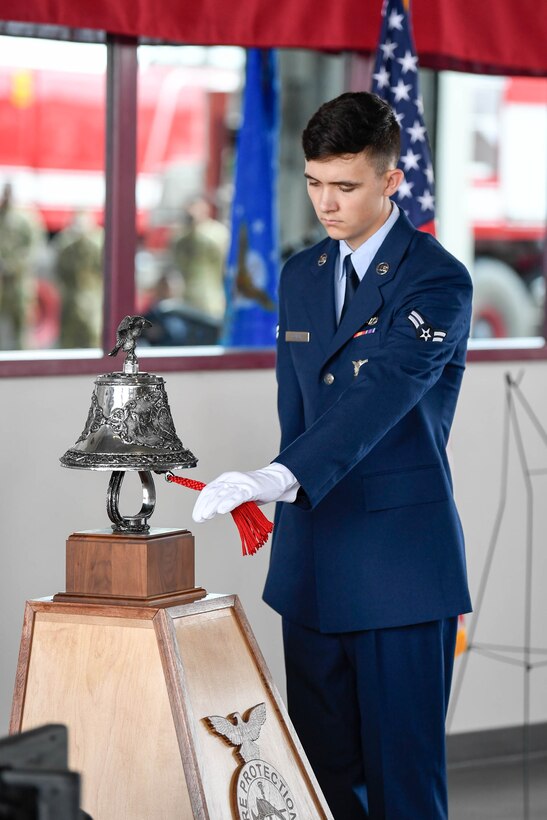 Airman 1st Class Devin Oliver, 436th Civil Engineer Squadron fire protection apprentice, performs the ringing of the bell ceremony during the 19th Anniversary 9/11 memorial event Sept. 11, 2020, at Dover Air Force Base, Delaware. The ringing of the “four fives” is a firefighter tradition that signals and honors when a firefighter has perished in the line of duty. (U.S. Air Force photo by Mauricio Campino)