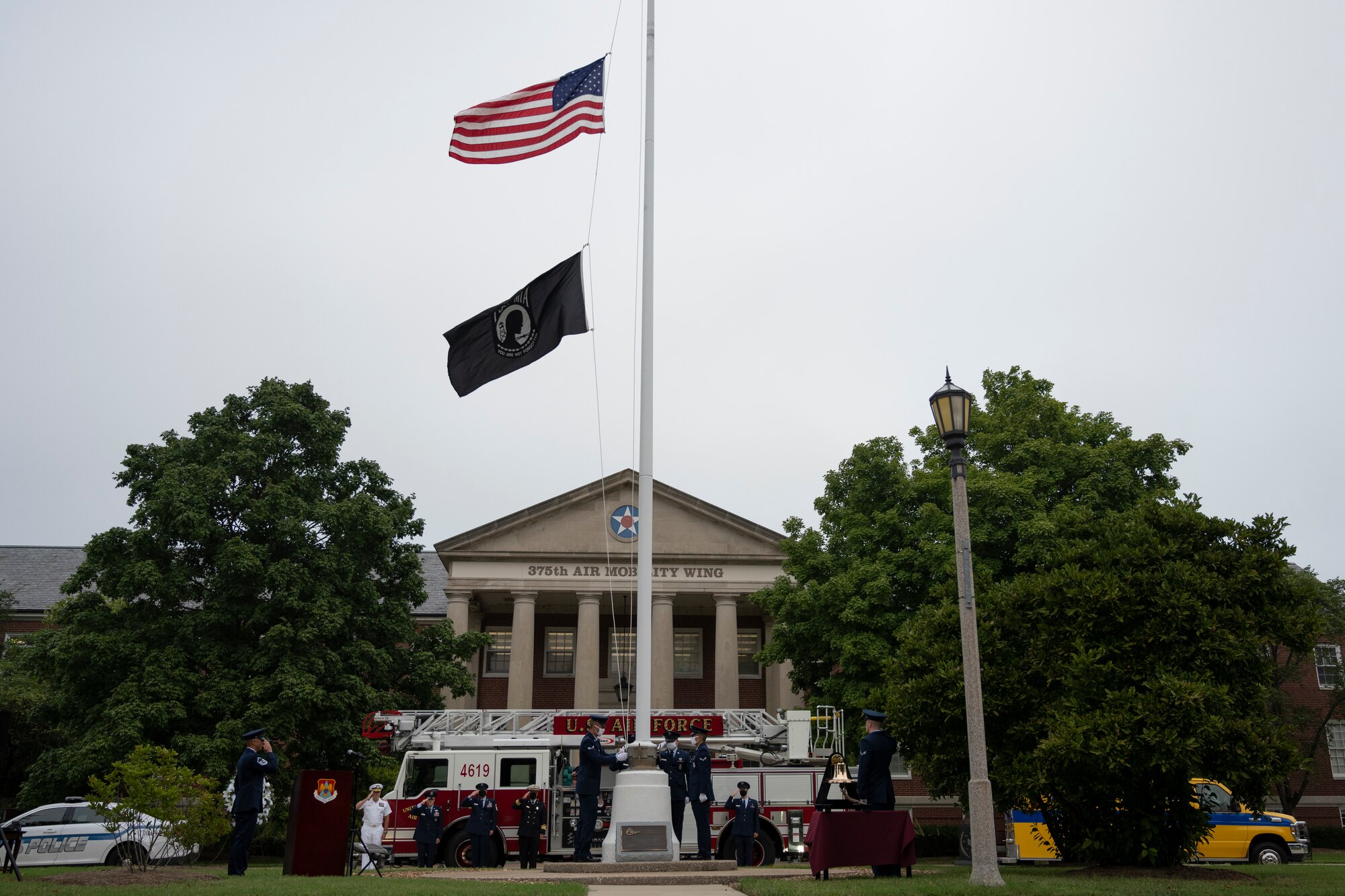 Service members raise U.S. Flag