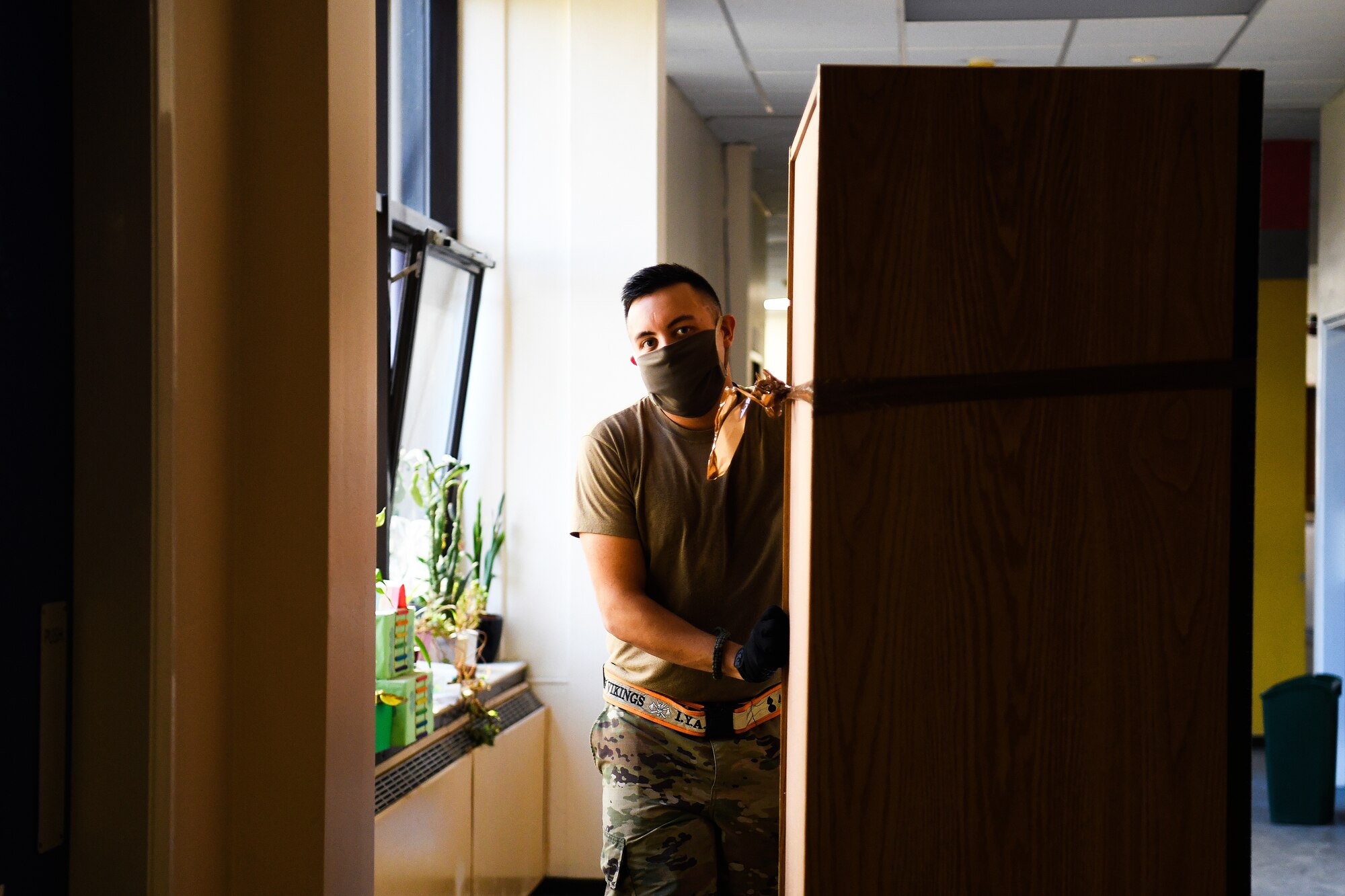 A 48th Fighter Wing Airman pushes a cabinet to a Lakenheath Elementary School classroom at Royal Air Force Lakenheath, England, Aug. 18, 2020. More than 300 personnel from squadrons across the installation volunteered to prepare the classrooms for the students’ arrival. (U. S. Air Force photo by Senior Airman Shanice Williams-Jones)