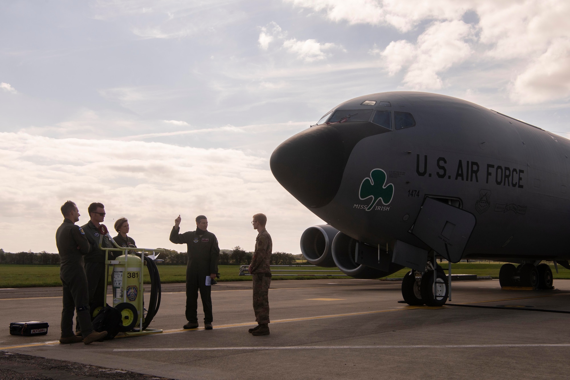 Aircrew of a KC-135 Stratotanker aircraft speak with a maintenance Airman before a training mission enabling exercise Point Blank at Royal Air Force Mildenhall, England, Sept. 10, 2020. The KC-135 Stratotanker supported the exercise through its transfer of fuel to allied and partner-nation aircraft. (U.S. Air Force photo by Airman 1st Class Joseph Barron)