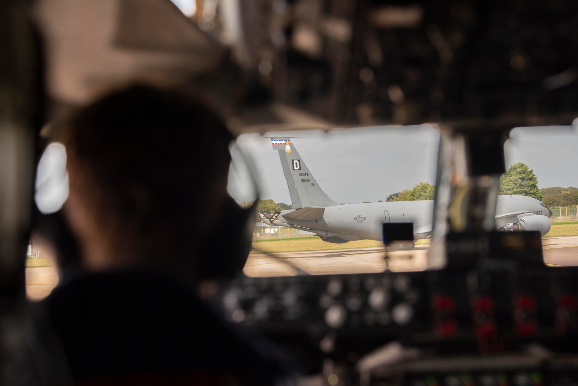 Major Christopher Miller, 351st Air Refueling Squadron pilot, waits for a KC-135 Stratotanker aircraft to turn onto the runway before taxiing at Royal Air Force Mildenhall, England, Sept. 10, 2020. Multiple KC-135 aircraft assigned to the 100th Air Refueling Wing helped refine the skill sets of allied and partner-nation pilots through aerial refueling support over the North Sea as part of exercise Point Blank. (U.S. Air Force photo by Airman 1st Class Joseph Barron)