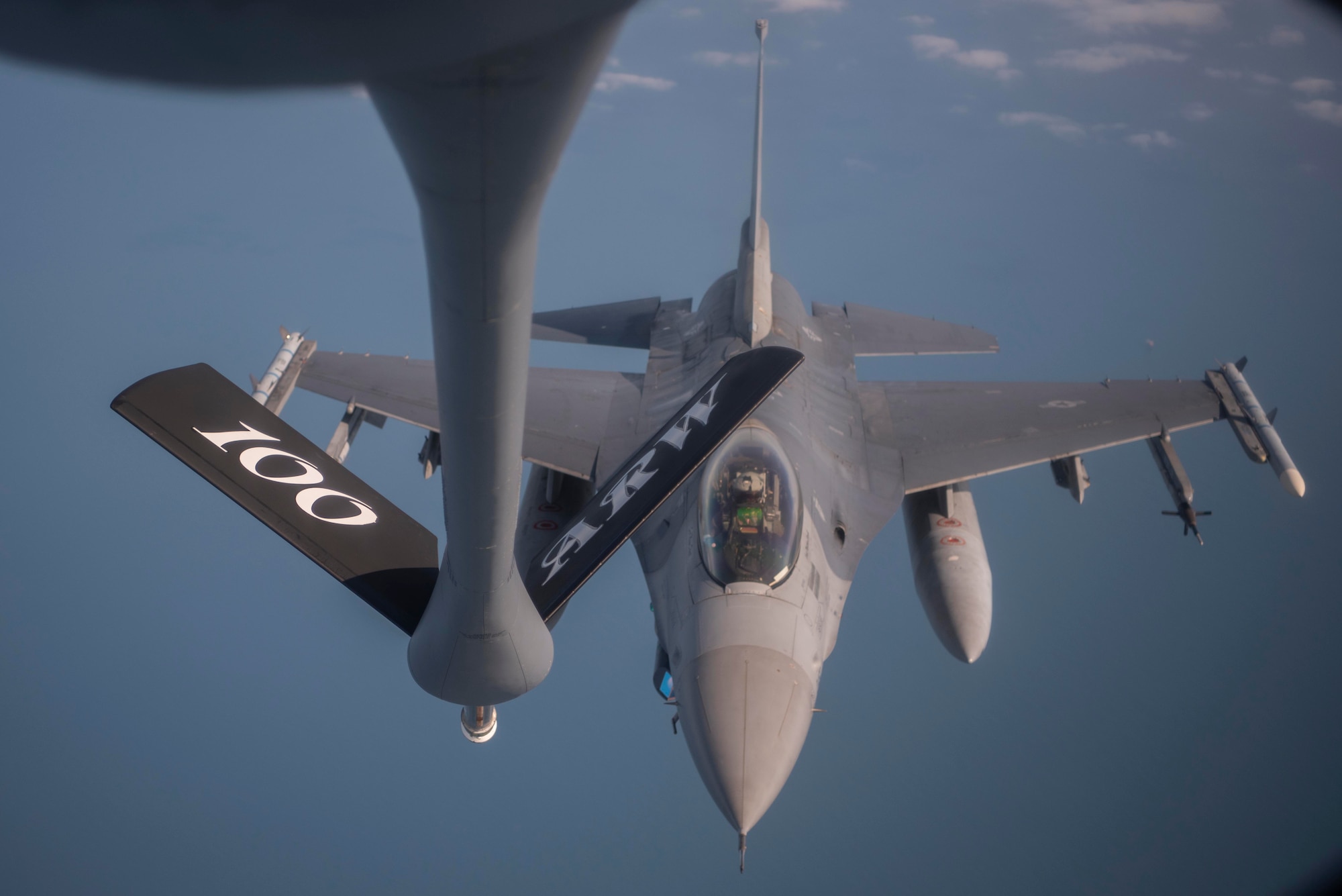 An F-16 Fighting Falcon aircraft assigned to the 31st Fighter Wing, Aviano Air Base, Italy, approaches a KC-135 Stratotanker aircraft assigned to the 100th Air Refueling Wing, Royal Air Force Mildenhall, England, to receive fuel during exercise Point Blank over the North Sea, Sept. 10, 2020. The KC-135 Stratotankers support training with joint and combined allies and partners through their in-air delivery of fuel, extending the effective range of receiver aircraft. (U.S. Air Force photo by Airman 1st Class Joseph Barron)