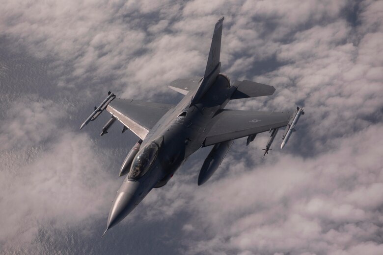 An F-16 Fighting Falcon aircraft assigned to the 31st Fighter Wing, Aviano Air Base, Italy, departs from a KC-135 Stratotanker aircraft assigned to the 100th Air Refueling Wing, Royal Air Force Mildenhall, England, after receiving fuel during exercise Point Blank over the North Sea, Sept 10, 2020. The KC-135 aircraft supported allied and partner-nation aircraft in sharpening combat readiness, increasing tactical proficiency, and demonstrating a collective commitment to regional security during the exercise. (U.S. Air Force photo by Airman 1st Class Joseph Barron)