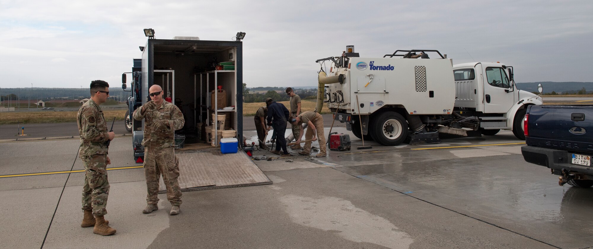 U.S. Air Force Airmen from the 52nd Civil Engineer Squadron pavements and construction equipment shop and 52nd Operations Support Squadron airfield management perform and supervise repairs on the flightline at Spangdahlem Air Base, Germany, Sept. 10, 2020. Constant repairs to the flightline are needed to ensure aircraft are always able to perform the mission. (U.S. Air Force photo by Airman 1st Class Alison Stewart)