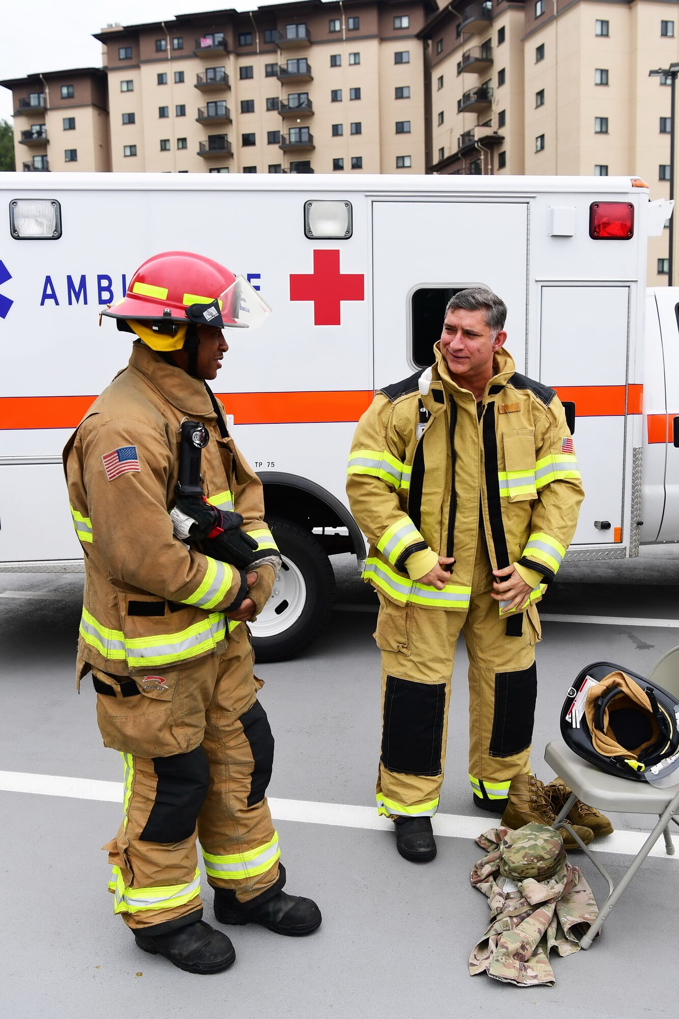 U.S. Air Force Col. John Gonzales, 51st Fighter Wing commander, puts on firegear to participate in the stair climb event at Osan Air Base, Republic of Korea, Sept. 11, 2020. The day marked the 19th anniversary of the 9/11 terrorist attack that claimed the lives of approximately 3,000 people and injured thousands more. (U.S. Air Force photo by Senior Airman Noah Sudolcan)