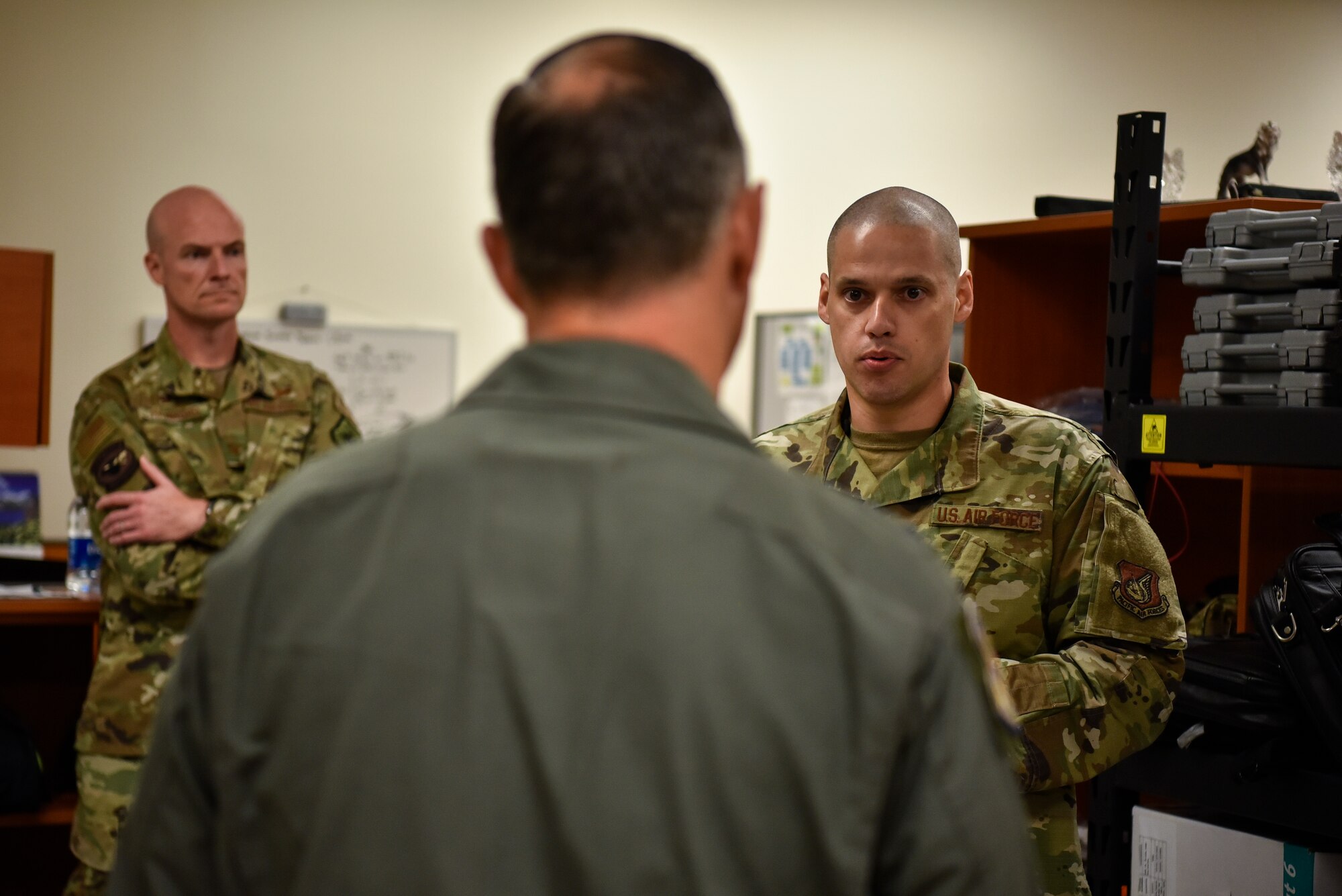 A photo of Airmen speaking.