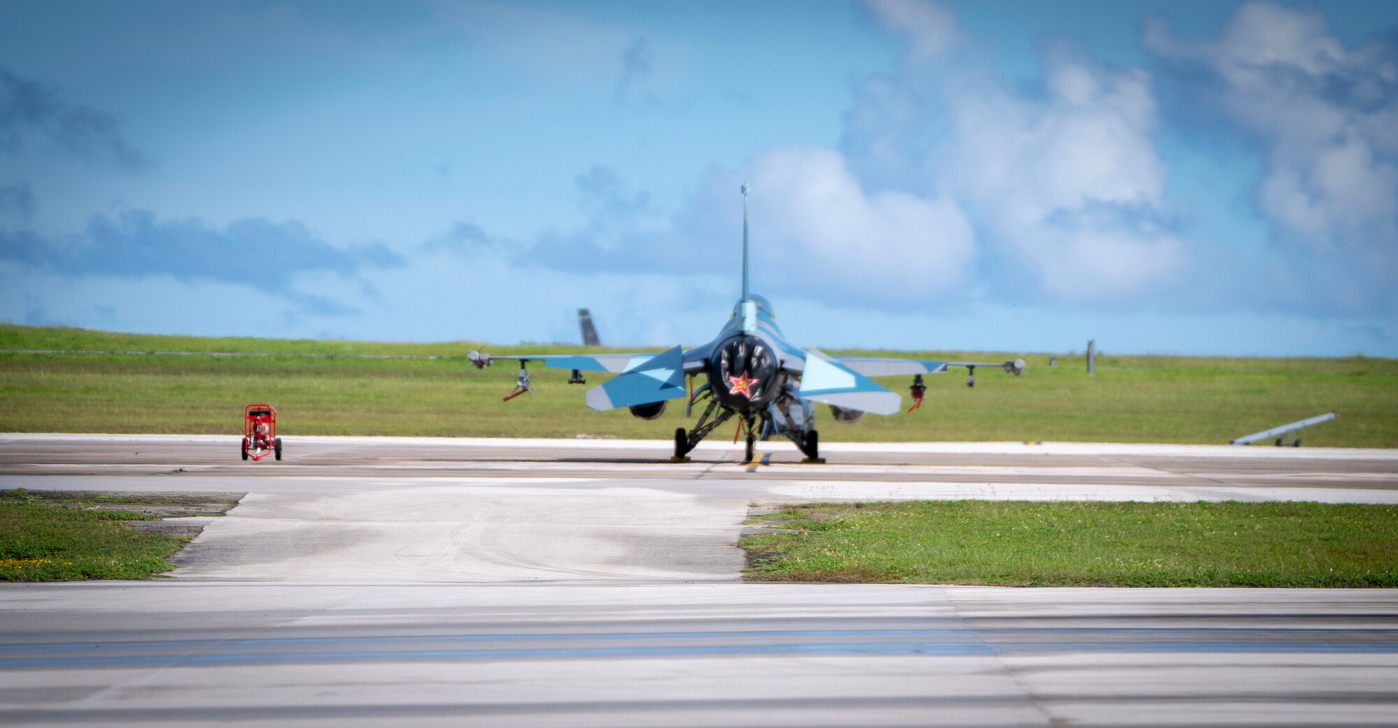 A U.S. Air Force F-16 Fighting Falcon assigned to the 18th Aggressor Squadron, Eielson Air Force Base, Alaska, sits on the flightline in support of Valiant Shield 2020 at Andersen AFB, Guam, Sept. 11, 2020.