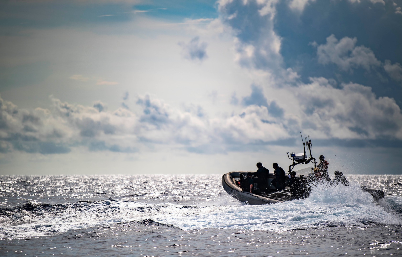 Sailors conduct visit, board, search, and seizure exercise in rigid-hull inflatable boat