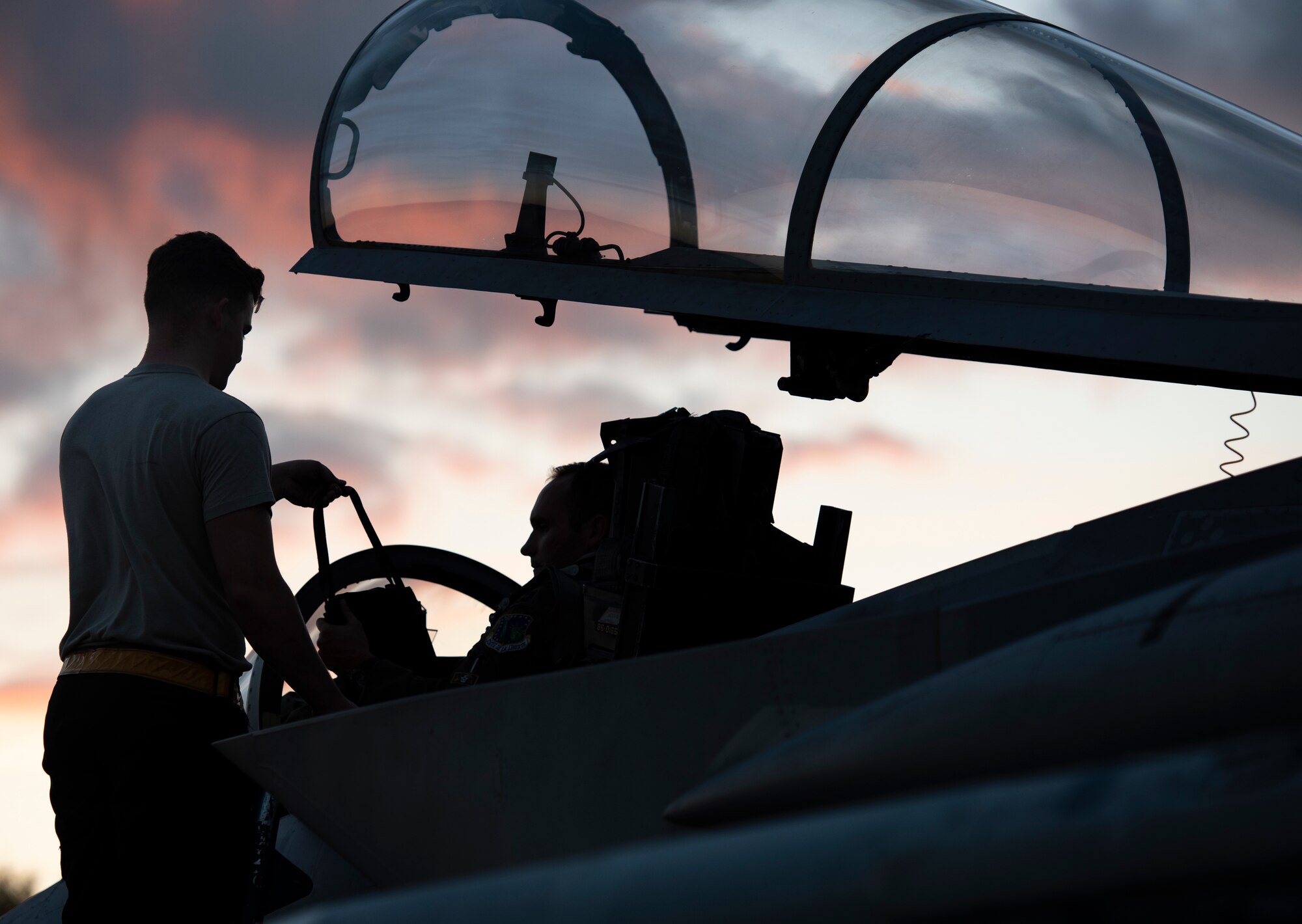 A U.S Air Force 748th Aircraft Maintenance Squadron crew chief and a pilot assigned to the 493rd Fighter Squadron prepare to launch at Royal Air Force Lakenheath, England, Sept. 8, 2020. Night Flying Exercises provide 48th Fighter Wing aircrew and support personnel the experience needed to maintain a ready force capable of ensuring the collective defence of the NATO alliance. (U.S. Air Force photo by Airman 1st Class Jessi Monte)