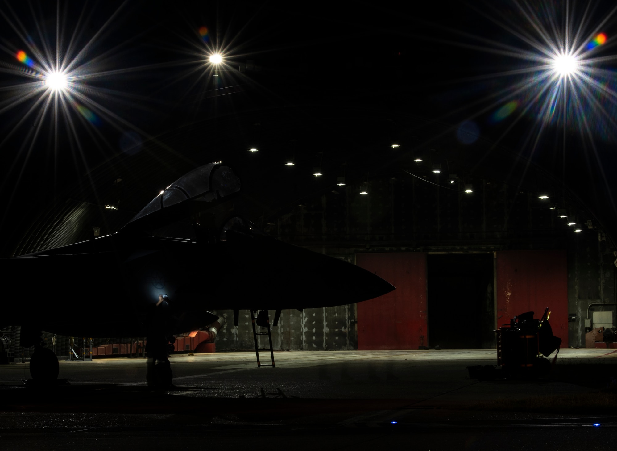 A U.S. Air Force crew chief, assigned to the 748th Aircraft Maintenance Squadron, performs routine post-flight maintenance on an F-15C Eagle at Royal Air Force Lakenheath, England, Sept. 8, 2020. Night Flying Exercises provide 48th Fighter Wing aircrew and support personnel the experience needed to maintain a ready force capable of ensuring the collective defence of the NATO alliance. (U.S. Air Force photo by Airman 1st Class Jessi Monte)