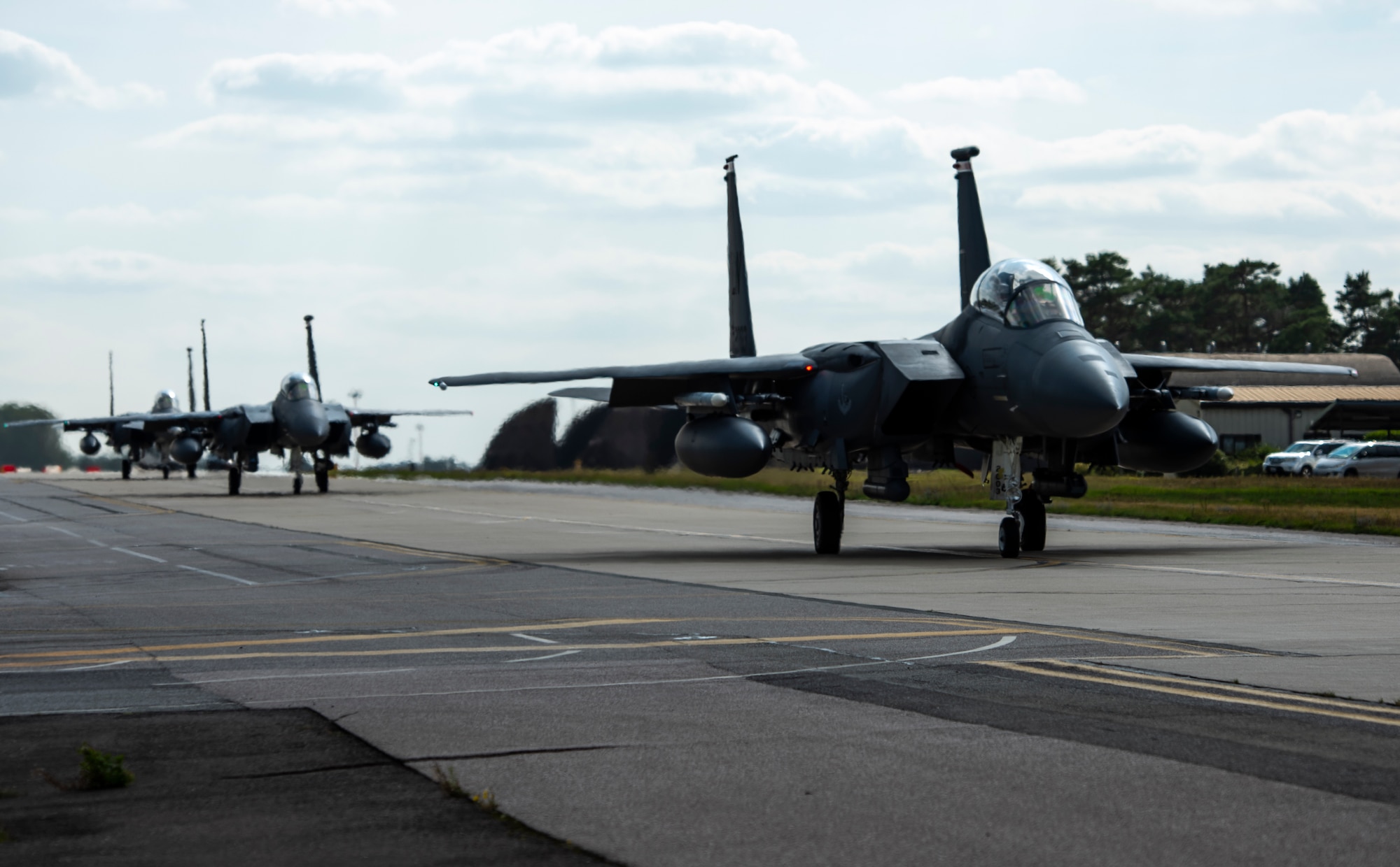 F-15E Strike Eagles assigned to the 48th Fighter Wing taxi down the flightline prior to takeoffs in support of exercise Point Blank 20-4 at Royal Air Force Lakenheath, England, Sept. 10, 2020.  Exercises like Point Blank increase interoperability and collective readiness with other NATO forces, deter potential adversaries and ensure the skies above the European theater remain sovereign. (U.S. Air Force photo by Airman 1st Class Jessi Monte)