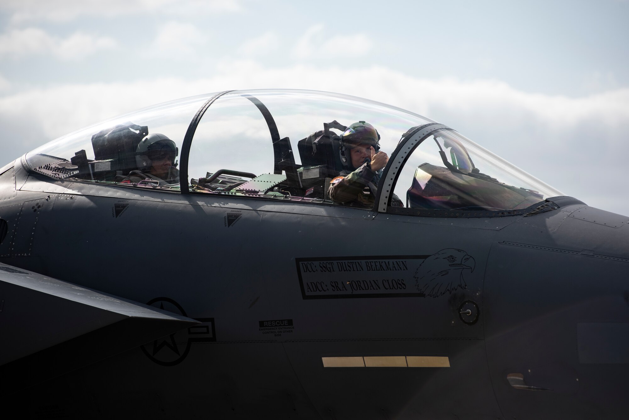 A U.S. Air Force pilot assigned to the 494th Fighter Squadron gives a thumbs up as he taxi’s an F-15E Strike Eagle down the flightline prior to takeoff in support of exercise Point Blank 20-4 at Royal Air Force Lakenheath, England, Sept. 10, 2020.  Exercises like Point Blank increase interoperability and collective readiness with other NATO forces, deter potential adversaries and ensure the skies above the European theater remain sovereign. (U.S. Air Force photo by Airman 1st Class Jessi Monte)