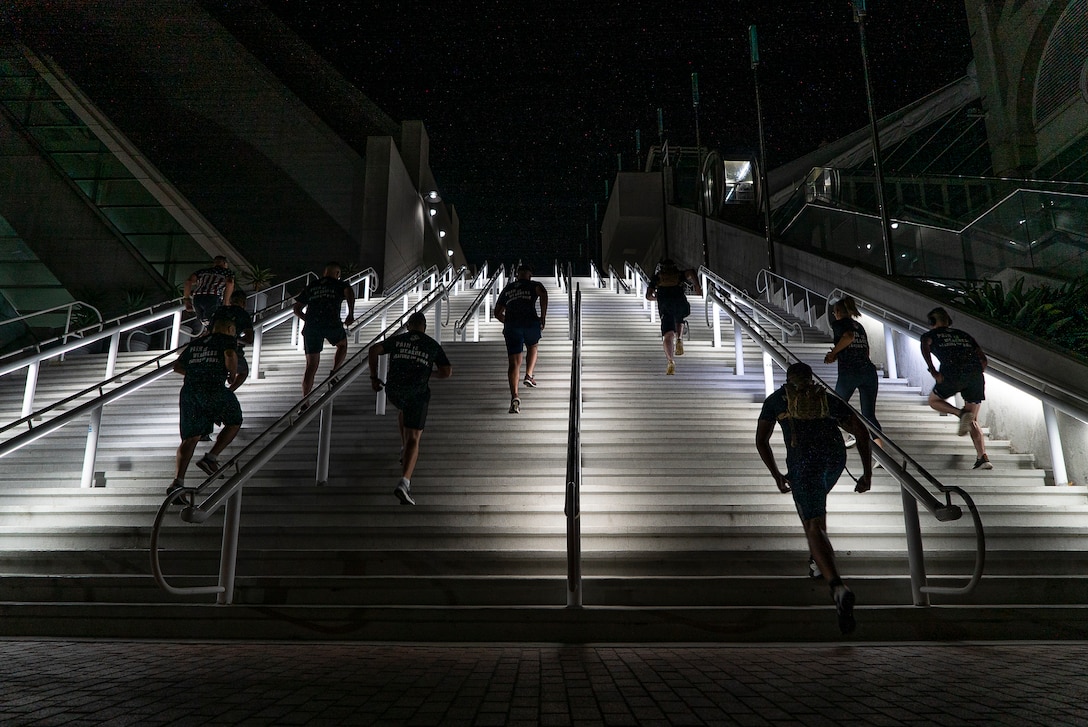 United States Marines assigned to the 12th Marine Corps District run up stairs during a stair walk at the San Diego Convention Center, San Diego, Calif., Sept. 11, 2020. The Marines simulated walking up and down one World Trade Center tower by traversing 110 flights of stairs. (U.S. Marine Corps photo by Sgt. Christian Cachola)