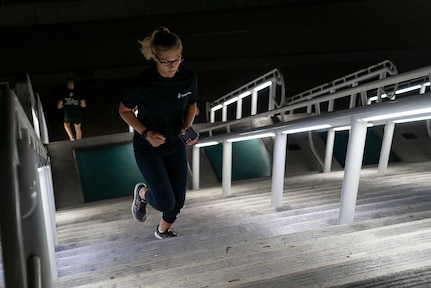 United States Marine Corps Cpl. Madisyn Sternotti, a supply clerk assigned to the 12th Marine Corps District, runs up a flight of stairs during stair walk at the San Diego Convention Center, San Diego, Calif., Sept. 11, 2020. The Marines simulated walking up and down one World Trade Center tower by traversing 110 flights of stairs. (U.S. Marine Corps photo by Sgt. Christian Cachola)