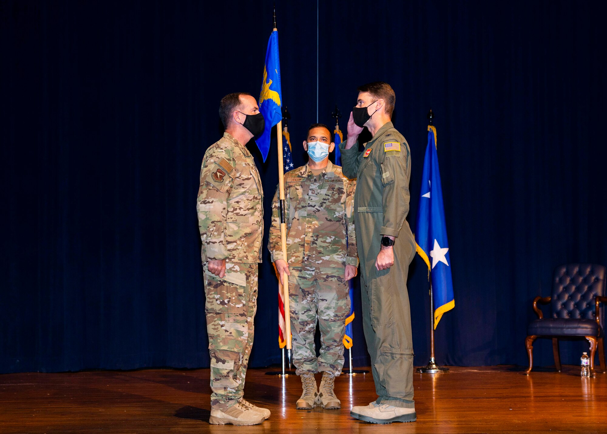 Maj. Gen. John P. Healy, 22nd Air Force commander, presents the guidon to Col. Christopher K. Lacouture, 913th Airlift Group commander, during an assumption of command ceremony at Little Rock Air Force Base, Ark, Sept. 12, 2020. The 913th AG is comprised of almost 400 personnel, 80 percent of which are part-time members balancing both civilian and military careers. (U.S. Air Force Reserve photo by Senior Airman Chase Cannon)
