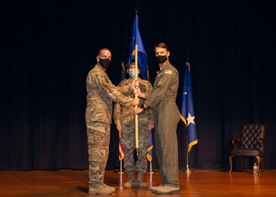 Maj. Gen. John P. Healy, 22nd Air Force commander, presents the guidon to Col. Christopher K. Lacouture, 913th Airlift Group commander, during an assumption of command ceremony at Little Rock Air Force Base, Ark, Sept. 12, 2020. The 913th AG is comprised of almost 400 personnel, 80 percent of which are part-time members balancing both civilian and military careers. (U.S. Air Force Reserve photo by Senior Airman Chase Cannon)