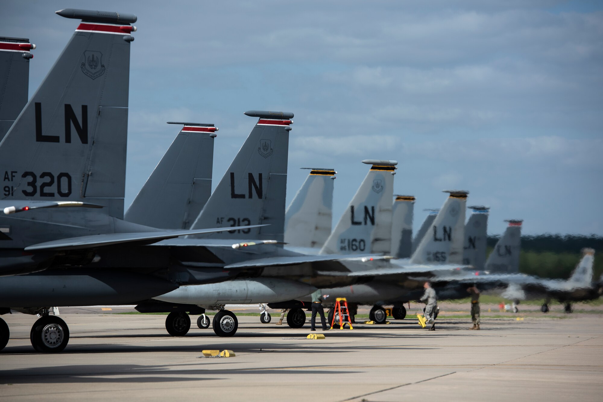 F-15E Strike Eagles and F-15C Eagles assigned to the 48th Fighter Wing line the taxiway prior to takeoffs in support of exercise Point Blank 20-4 at Royal Air Force Lakenheath, England, Sept. 10, 2020.  Exercises like Point Blank increase interoperability and collective readiness with other NATO forces, deter potential adversaries and ensure the skies above the European theater remain sovereign. (U.S. Air Force photo by Airman 1st Class Jessi Monte)