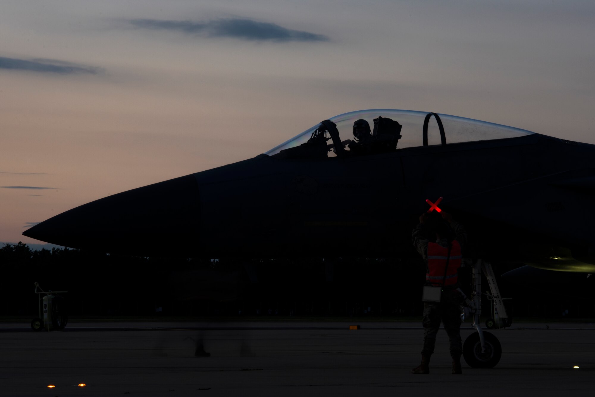 A U.S. Air Force F-15C Eagle, assigned to the 493rd Fighter Squadron, awaits completion of pre-flight checks at Royal Air Force Lakenheath, England, Sept. 8, 2020. Night Flying Exercises provide 48th Fighter Wing aircrew and support personnel the experience needed to maintain a ready force capable of ensuring the collective defence of the NATO alliance. (U.S. Air Force photo by Airman 1st Class Jessi Monte)