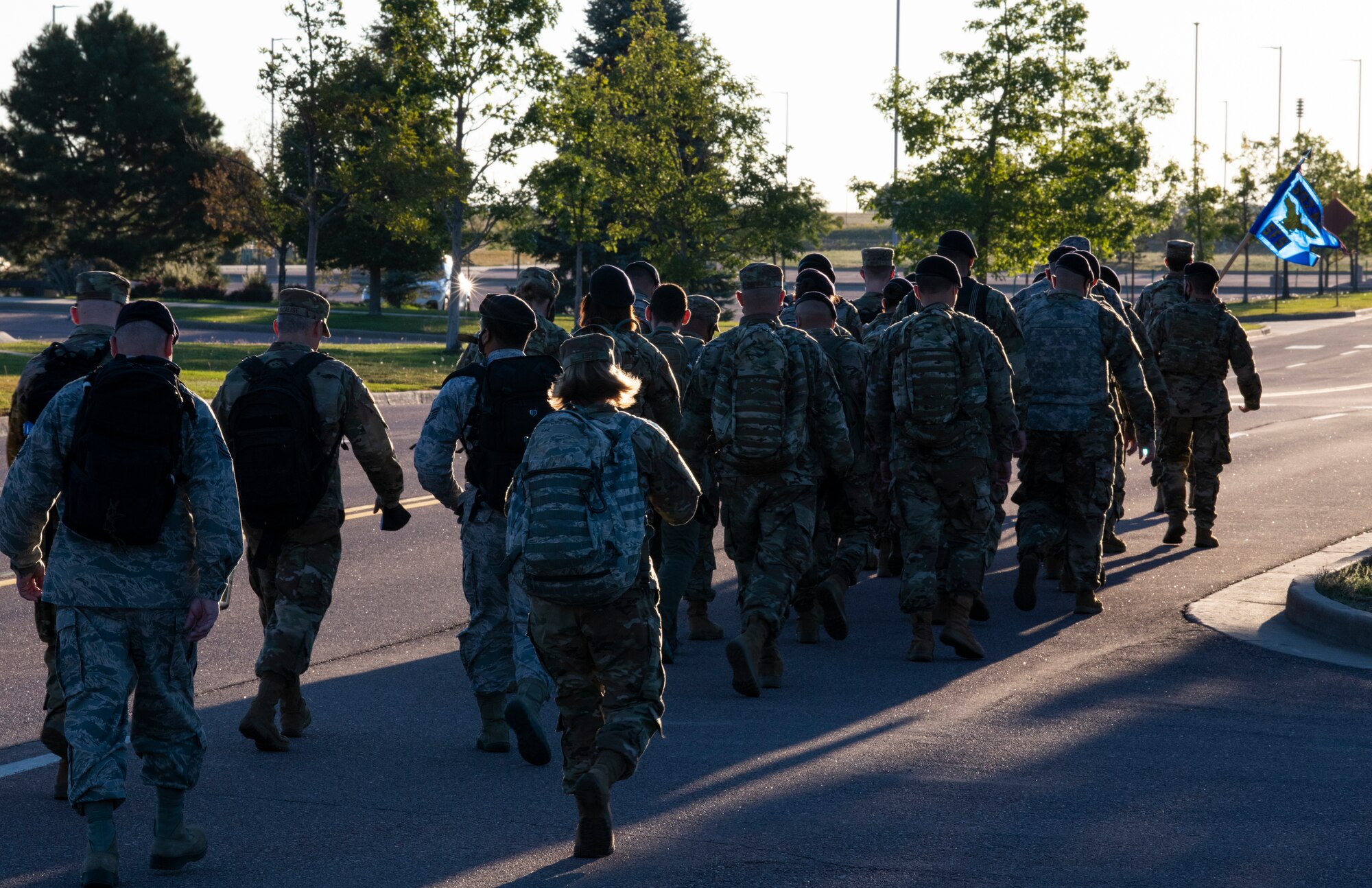 Members of the 302nd Security Forces Squadron perform a 4-mile Sunday morning ruck march