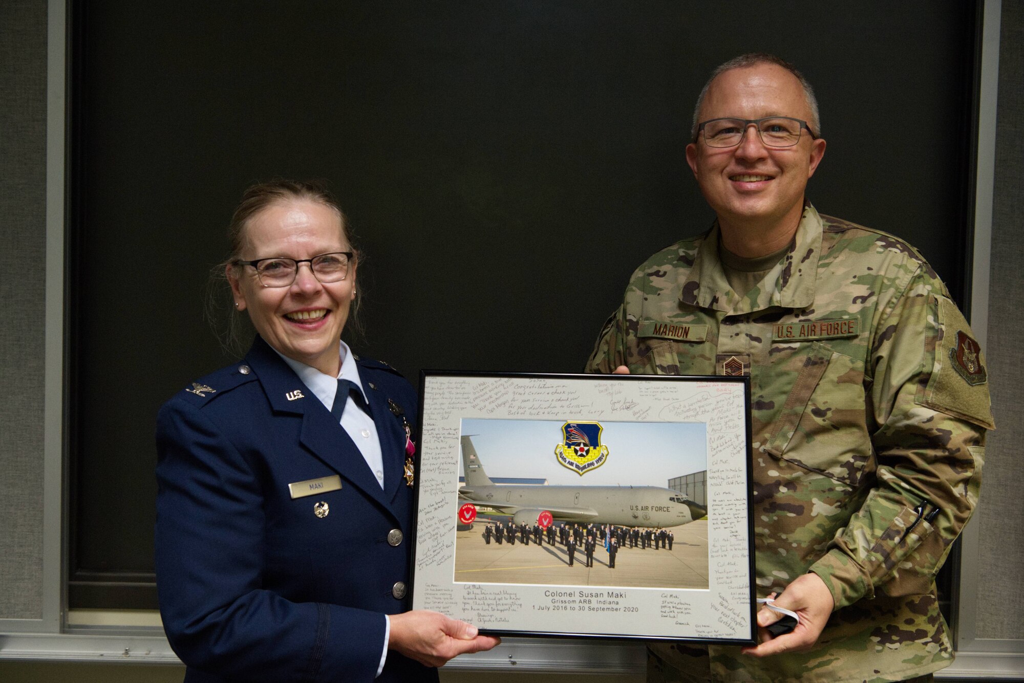 Chief Master Sgt. Wesley Marion, 434th Air Refueling Wing command chief, presents a gift to Col. Susan Maki, 434th ARW inspector general, at a retirement ceremony at Grissom Air Reserve Base, Ind., Sept. 12, 2020. Maki retired after 32 years of service in the Minnesota Air Guard and Air Force Reserve. (U.S. Air Force Photo / A1C Harrison Withrow)